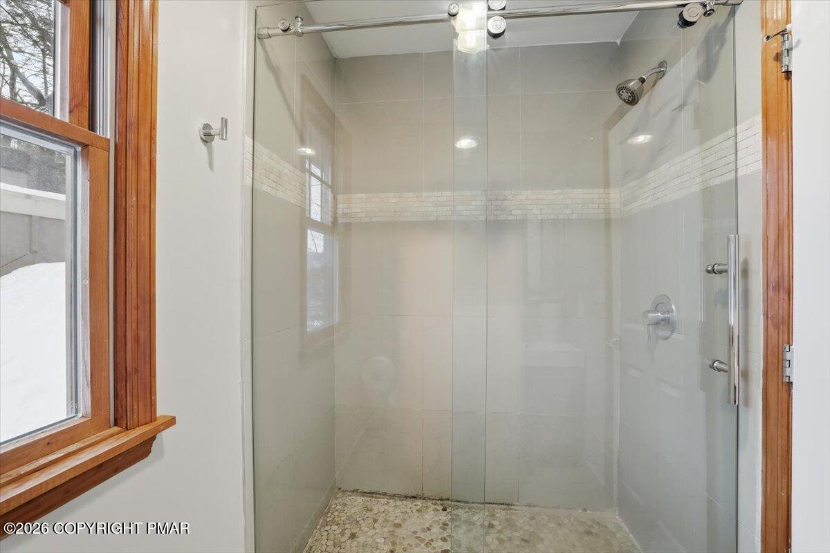 782 Lower Deer Valley Road Tannersville, PA 18372 - Photo 43 of 56 a bathroom with a shower and a glass door