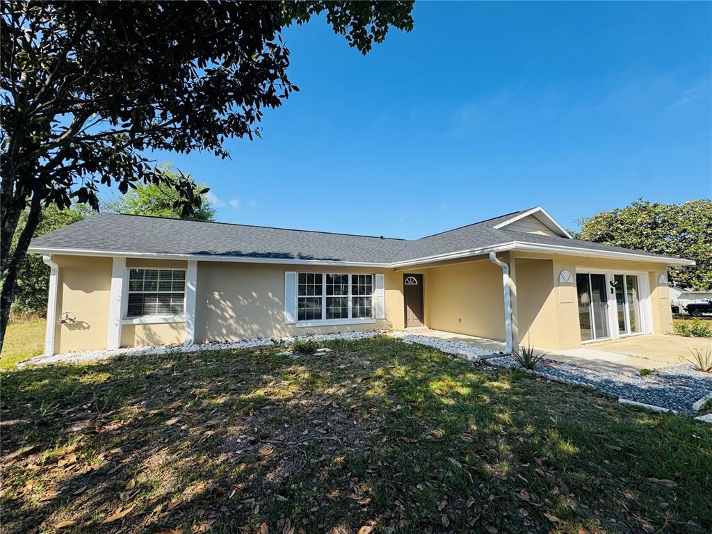 front view of a house with a yard
