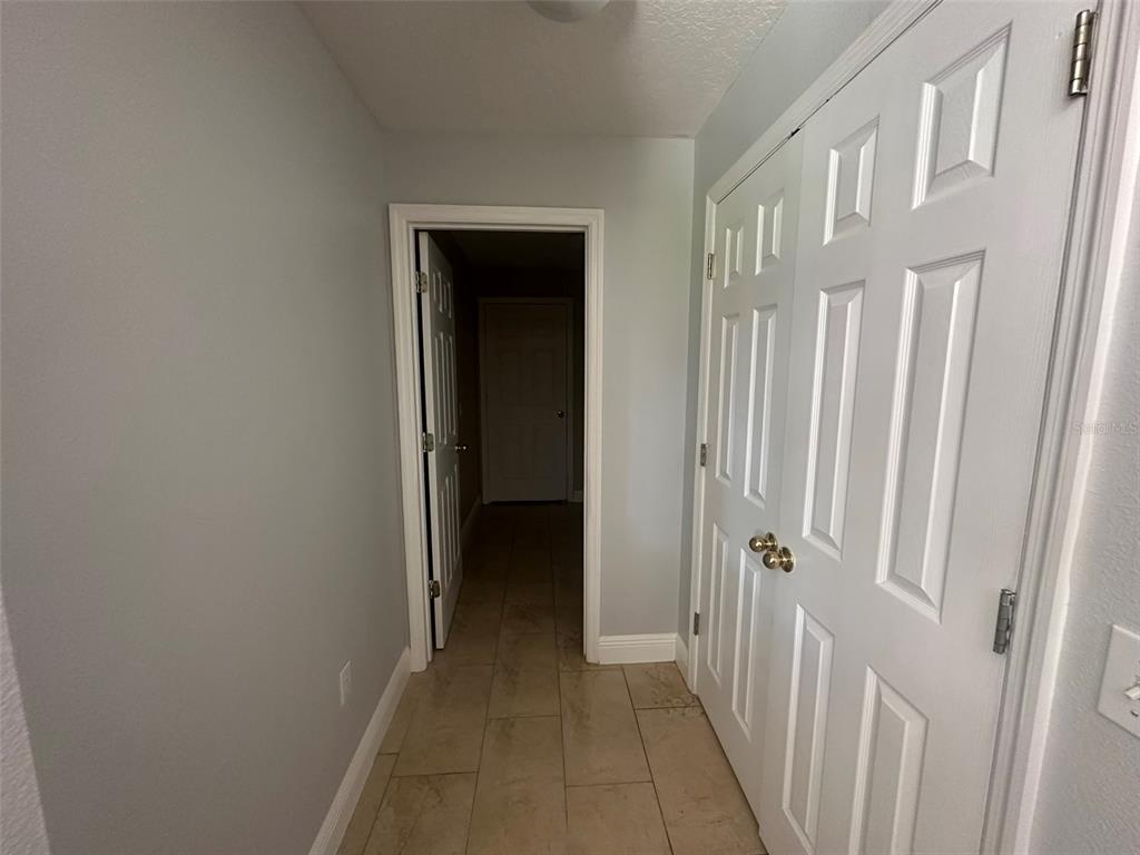 2510 Hassonite Street Kissimmee, FL 34744 - Photo 12 of 22 a view of a hallway with a white door