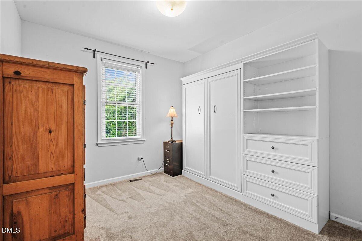3331 Swinford Court Raleigh, NC 27604 - Photo 23 of 27 a view of walk in closet with cabinet