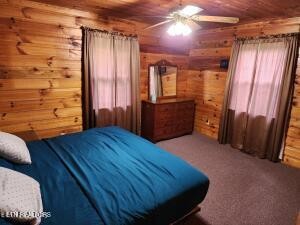 2880 Fairview Road Madisonville, TN 37354 - Photo 32 of 37 a bedroom with a bed and wooden floor