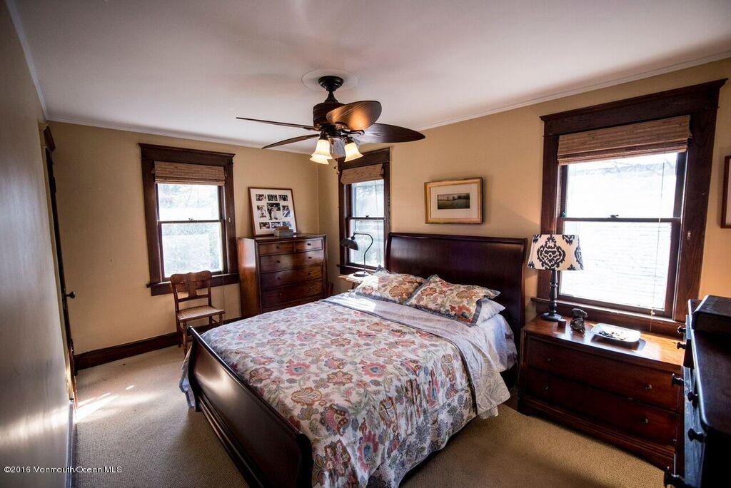 89 Pinckney Road Red Bank, NJ 07701 - Photo 12 of 26 a bedroom with a bed and a window