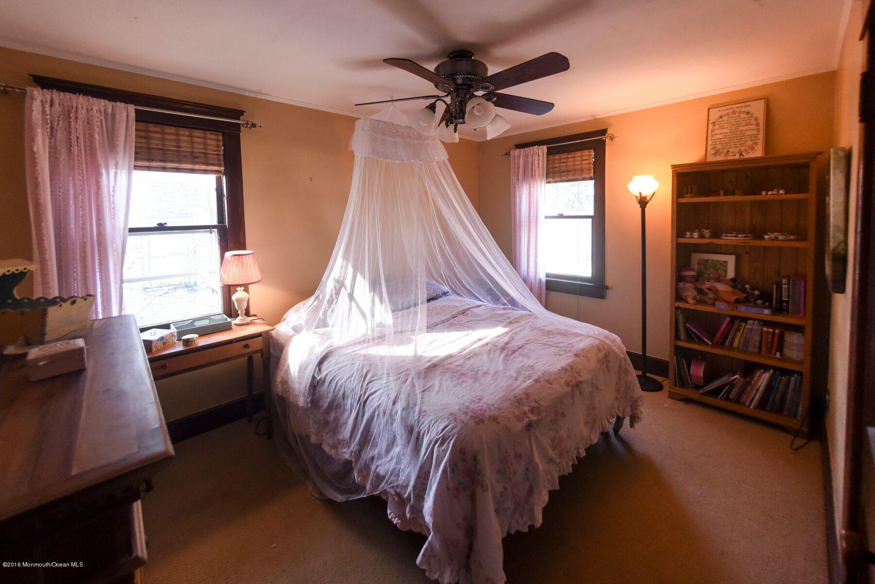 89 Pinckney Road Red Bank, NJ 07701 - Photo 13 of 26 a bed room with a bed and a window