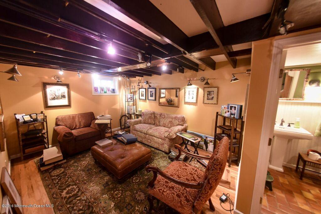 89 Pinckney Road Red Bank, NJ 07701 - Photo 15 of 26 a living room with furniture and a glass door