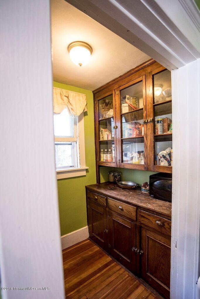 89 Pinckney Road Red Bank, NJ 07701 - Photo 8 of 26 a kitchen with granite countertop wooden cabinets and a dishwasher