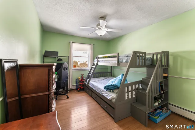 a view of an entryway with wooden floor