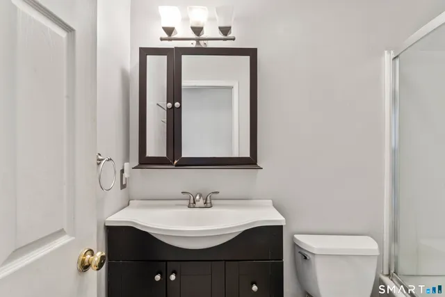 a view of hallway with wooden floor