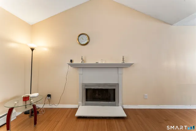 a view of a a dining room with furniture window and wooden floor