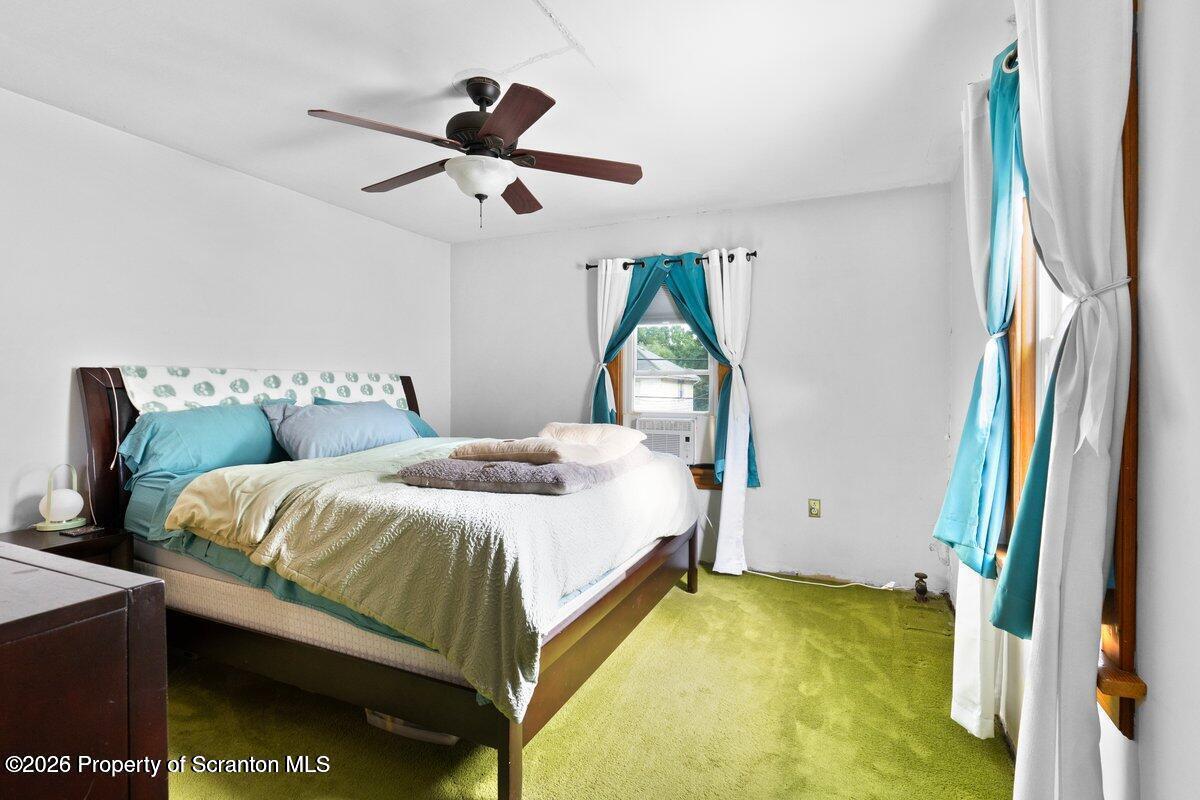 2129 Comegys Avenue Scranton, PA 18509 - Photo 14 of 22 a bedroom with a bed and a chandelier