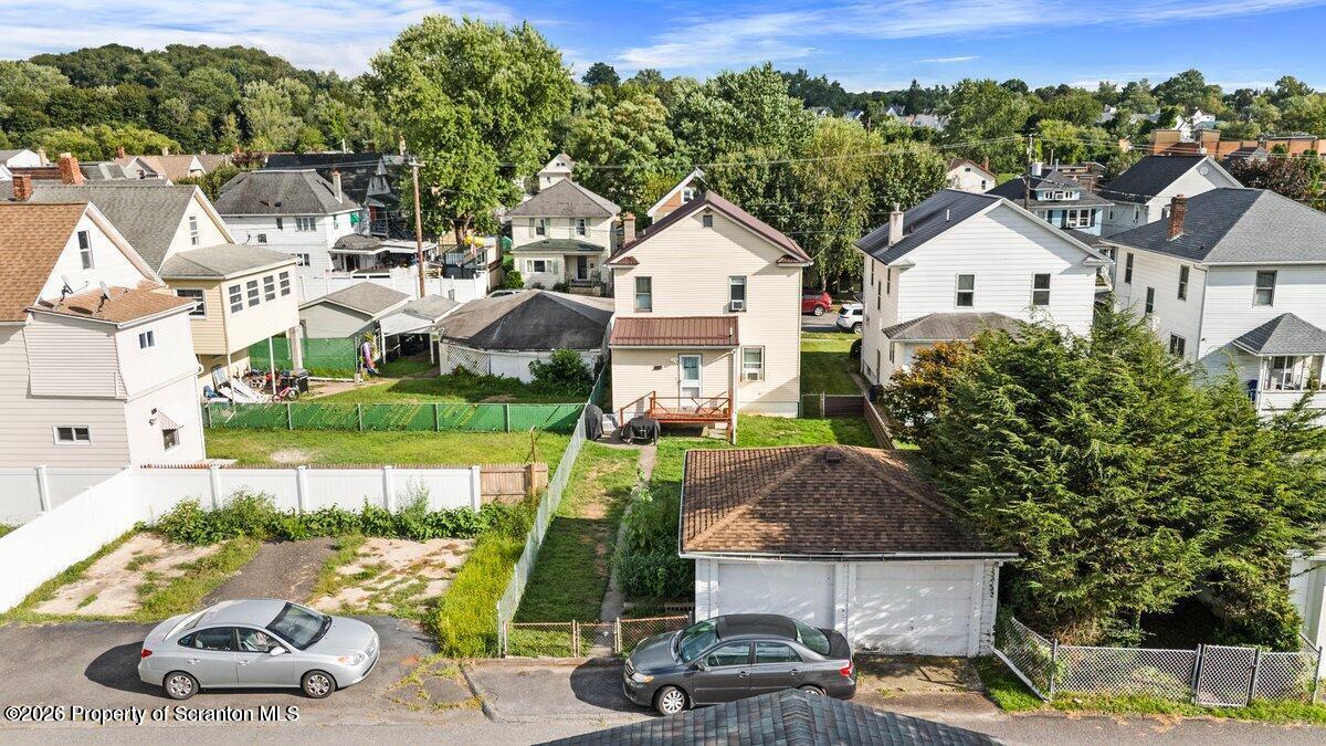 2129 Comegys Avenue Scranton, PA 18509 - Photo 2 of 22 a view of a white house with a yard and table and chairs