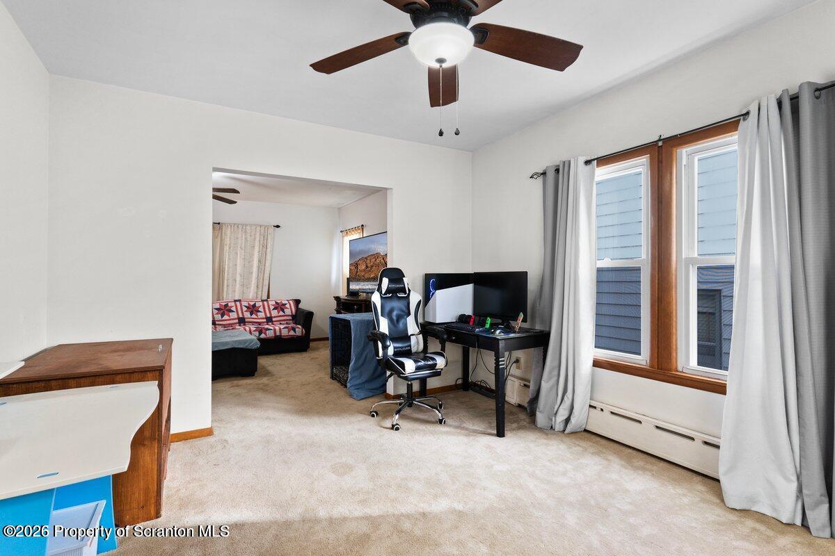 2129 Comegys Avenue Scranton, PA 18509 - Photo 10 of 22 a view of a livingroom with workspace and a window