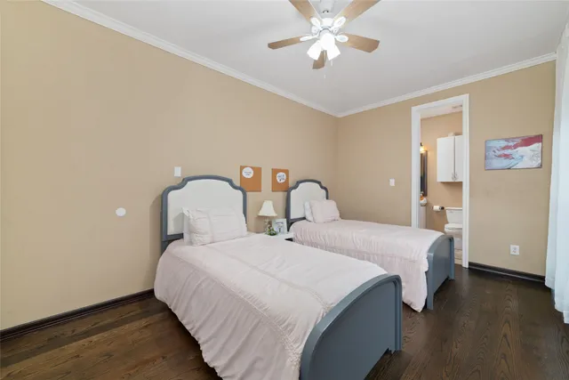 a bedroom with bed and a chandelier
