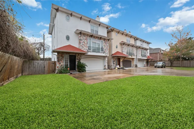 a view of a building with a yard
