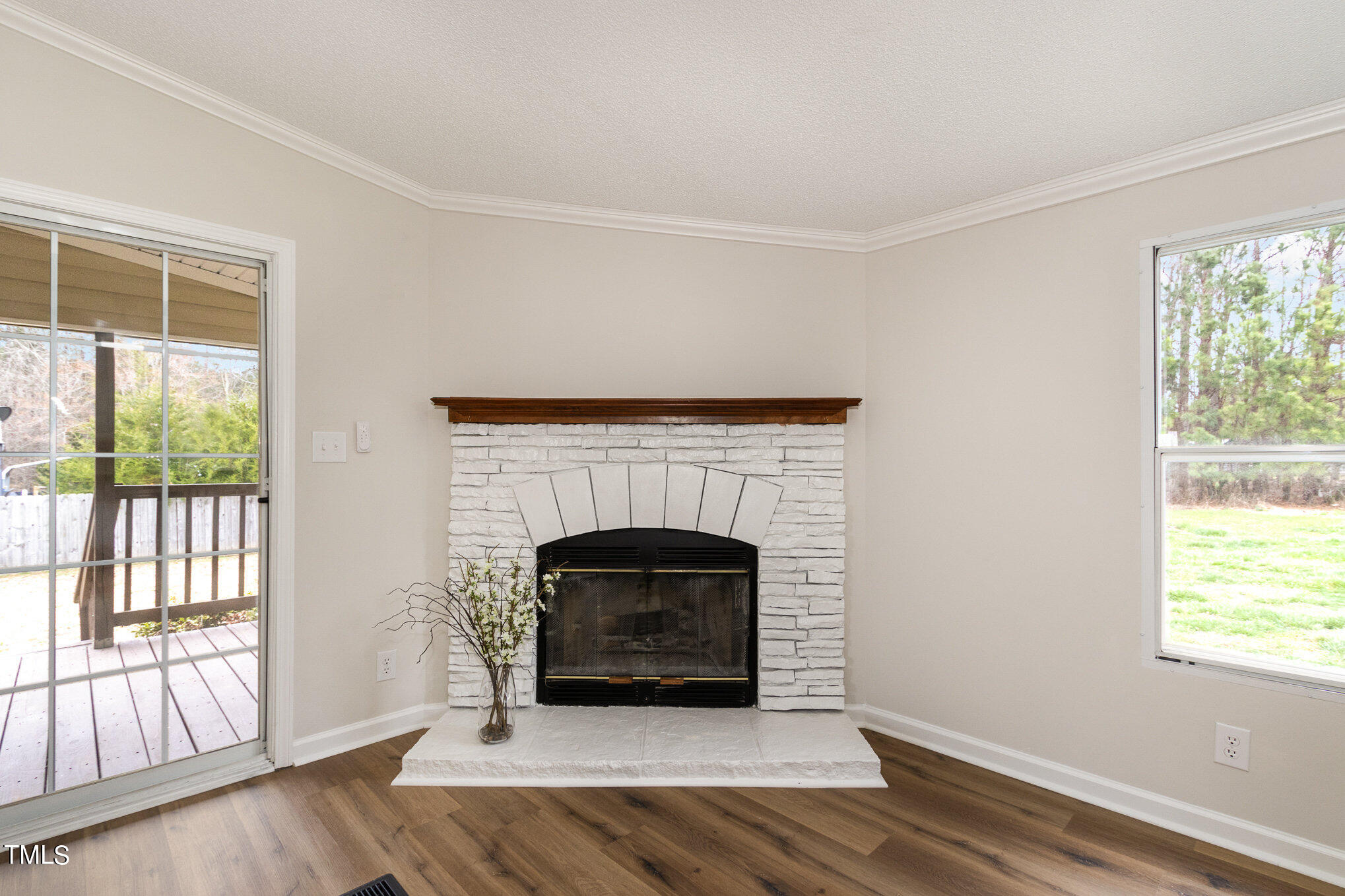 1183 Diamond Hills Road Stem, NC 27581 - Photo 11 of 28 a living room with furniture and a fireplace