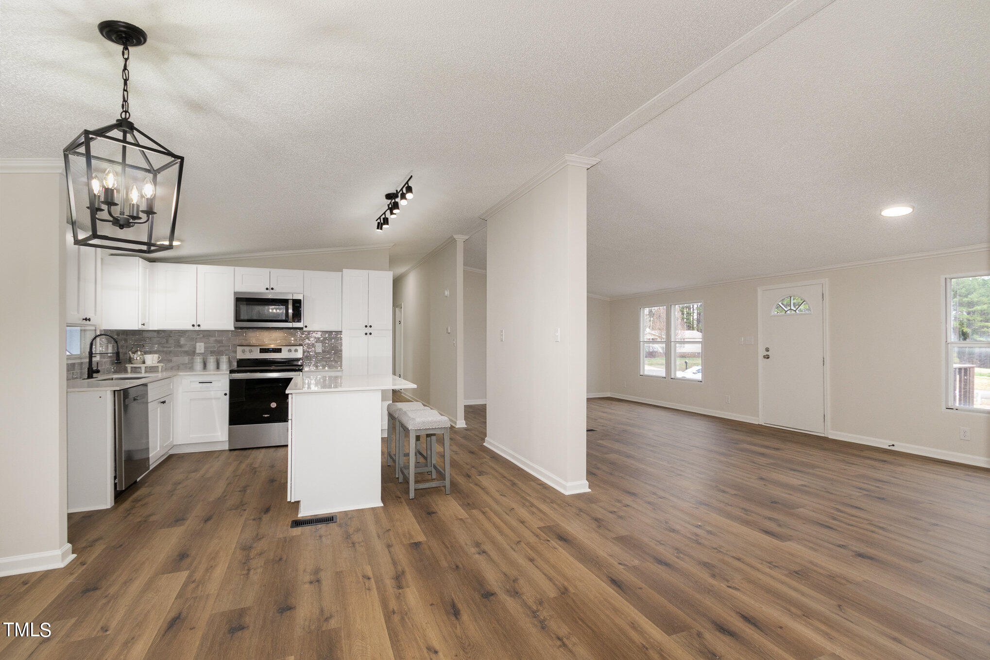 1183 Diamond Hills Road Stem, NC 27581 - Photo 13 of 28 a view of a kitchen with sink and wooden floor