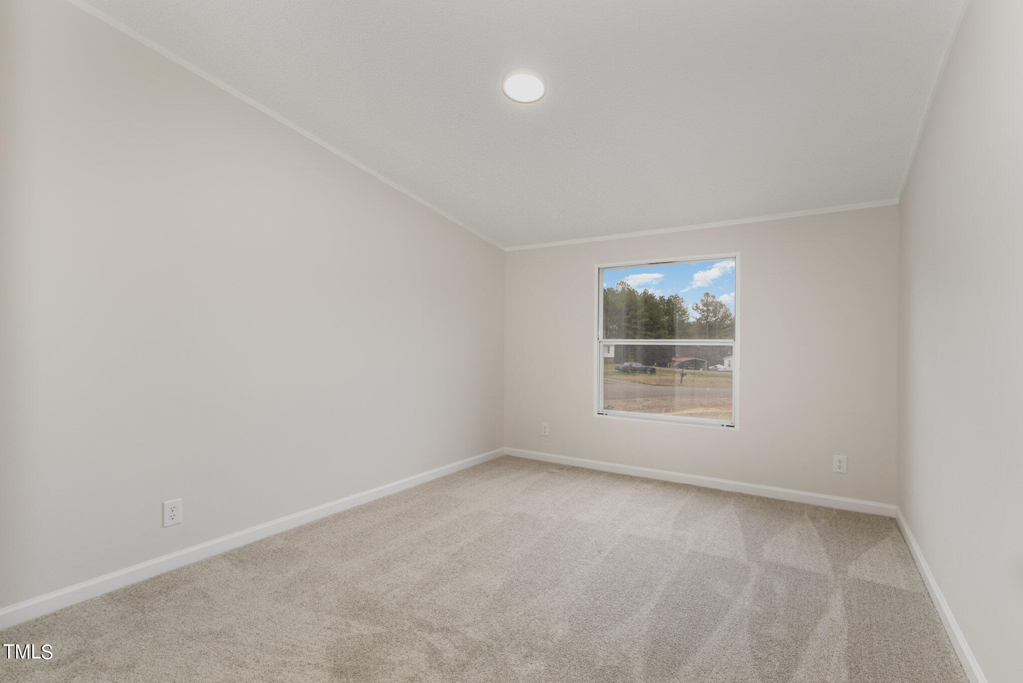 1183 Diamond Hills Road Stem, NC 27581 - Photo 19 of 28 an empty room with a window