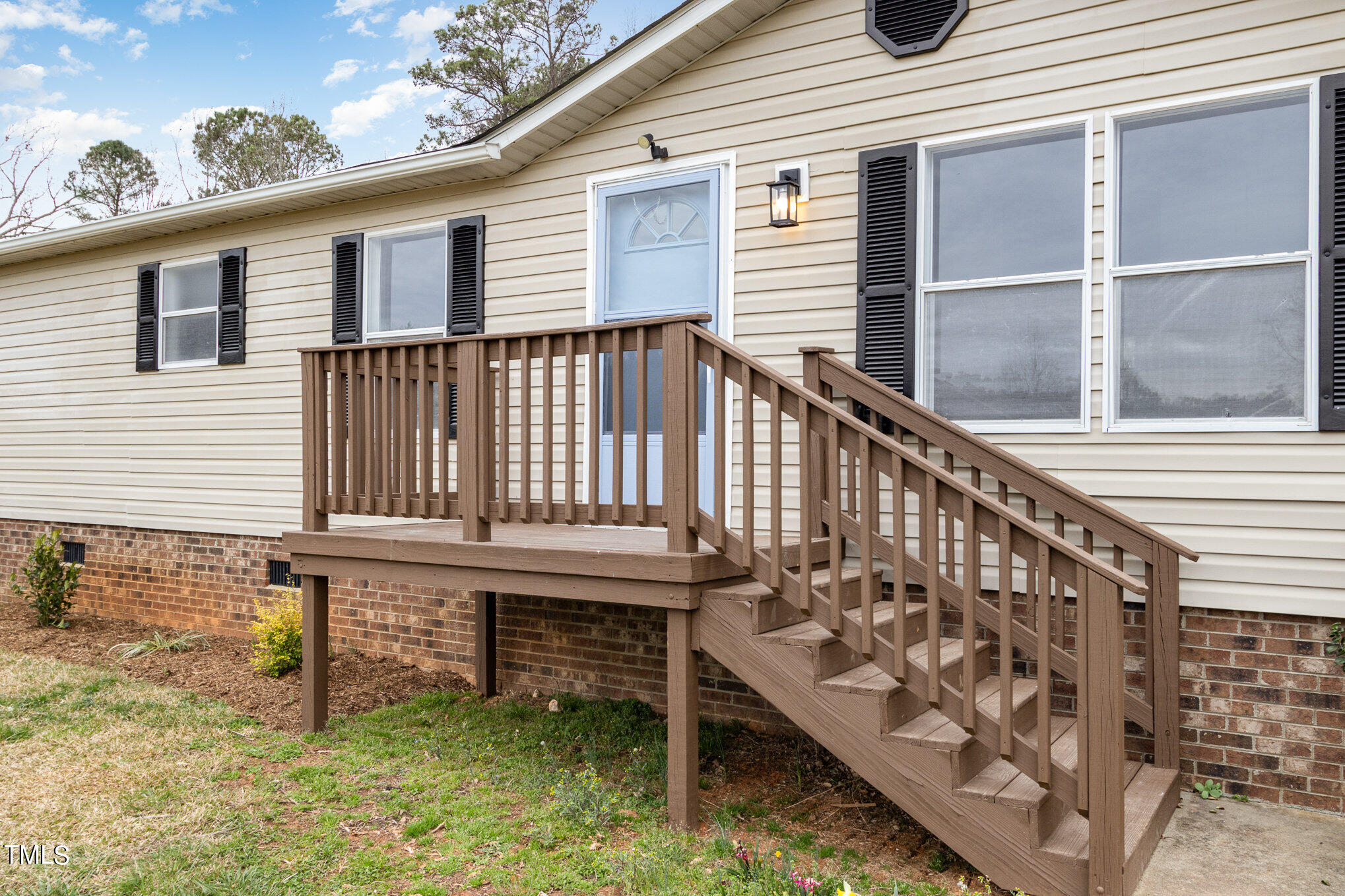 1183 Diamond Hills Road Stem, NC 27581 - Photo 2 of 28 a view of a chair and table in the balcony