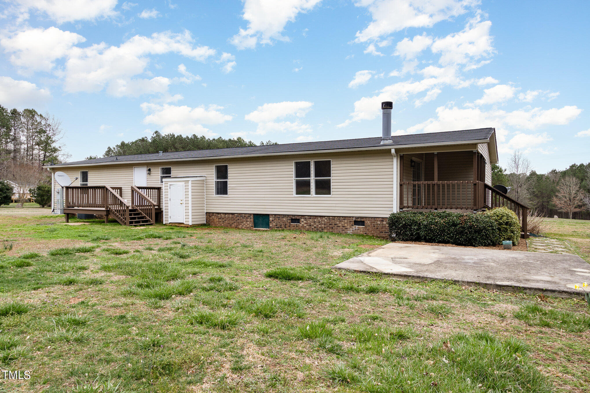 1183 Diamond Hills Road Stem, NC 27581 - Photo 25 of 28 a view of a house with a yard