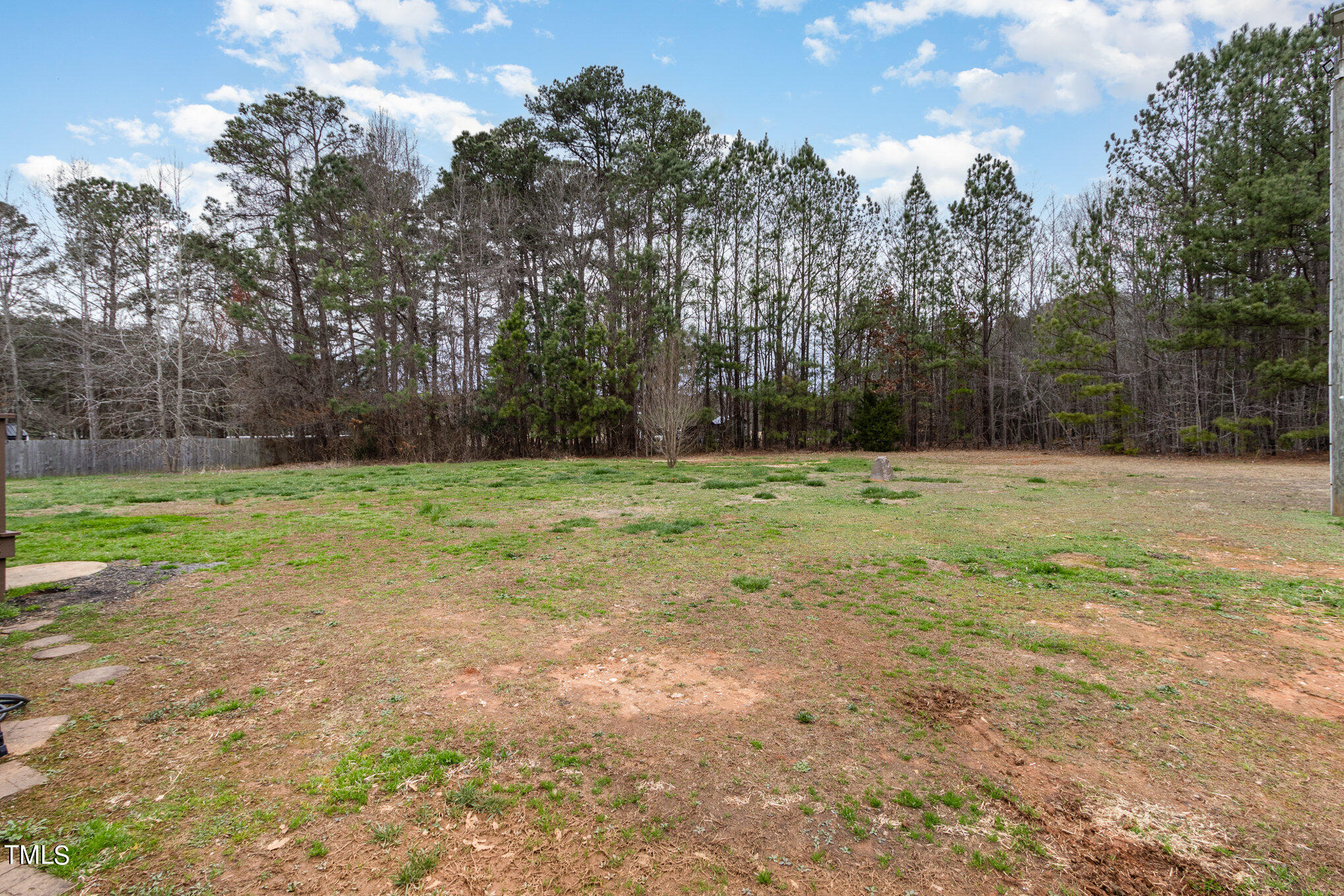 1183 Diamond Hills Road Stem, NC 27581 - Photo 27 of 28 a view of outdoor space with trees all around