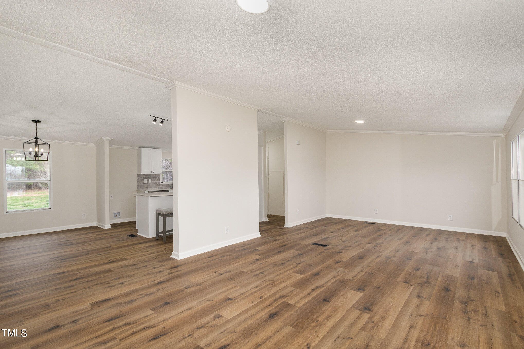 1183 Diamond Hills Road Stem, NC 27581 - Photo 3 of 28 a view of empty room with wooden floor and window
