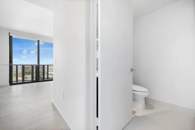 a view of a bathroom with a toilet