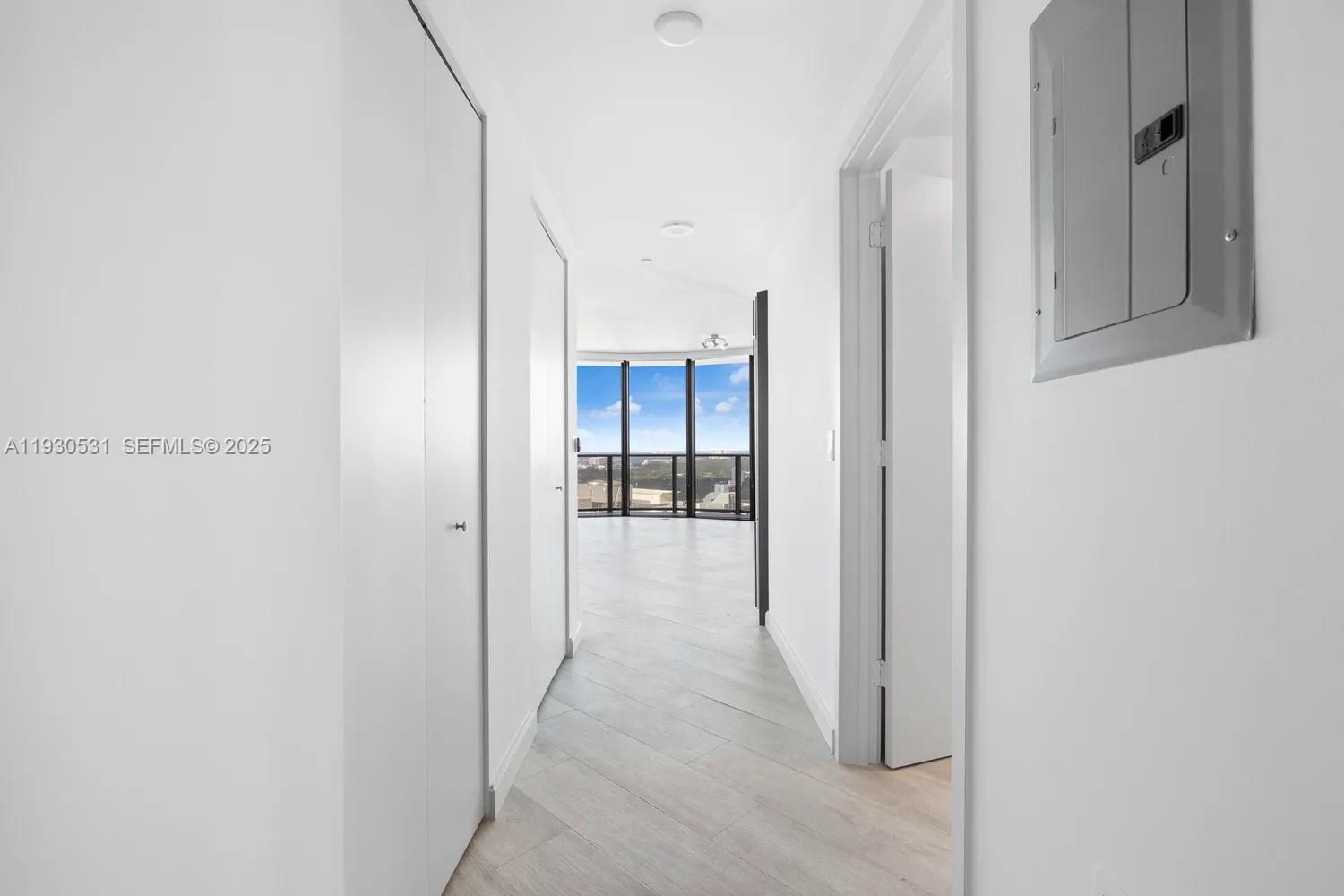 55 Southwest 9th Street, Unit 3806 Miami, FL 33130 - Photo 15 of 24 a view of a hallway with an entryway and closet