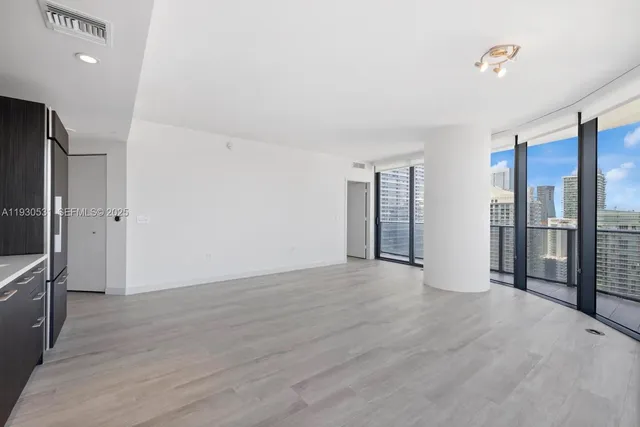 a view of an empty room with a window