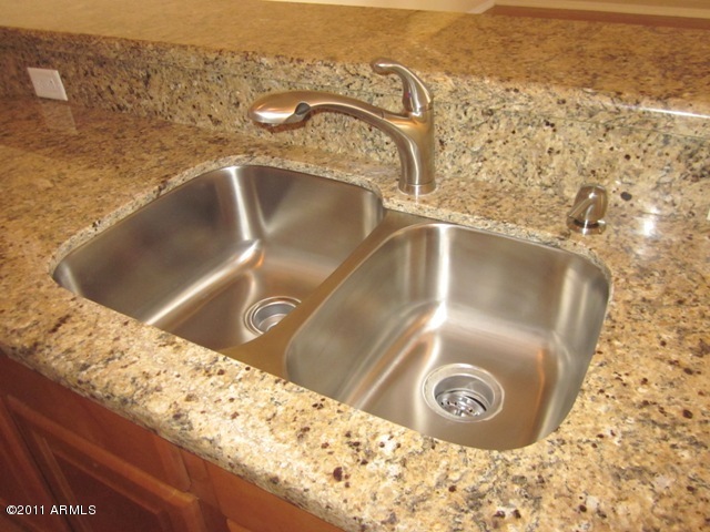 15686 West Peak View Road Surprise, AZ 85387 - Photo 3 of 17 New granite, sink, and faucet