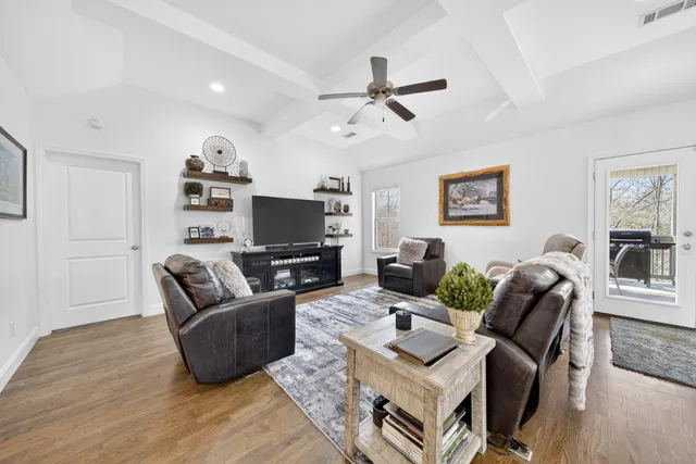 a living room with furniture and a rug