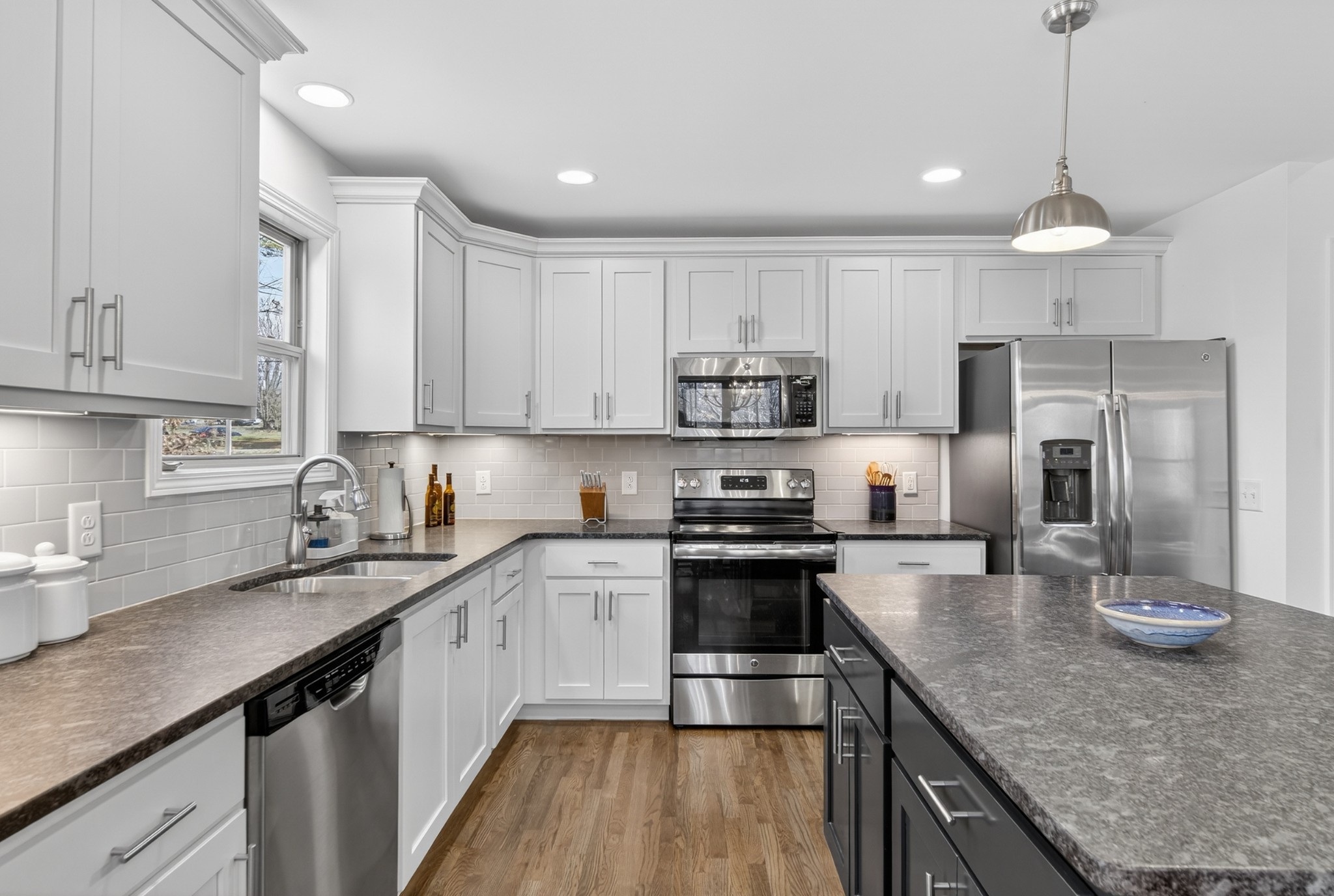 6716 Old Highway 431 Springfield, TN 37172 - Photo 26 of 58 a kitchen with stainless steel appliances granite countertop a sink a stove top oven a refrigerator and cabinets