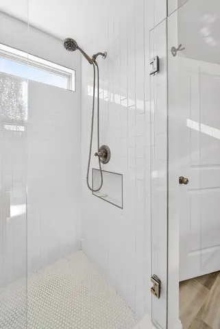 a bathroom with a double vanity sink toilet and a mirror