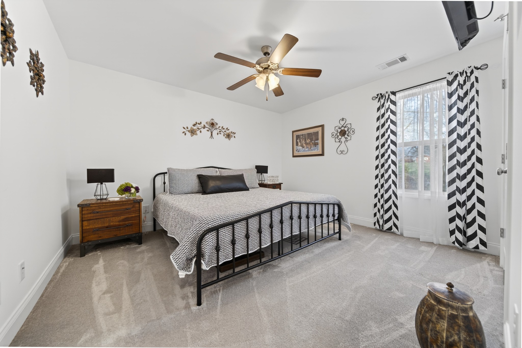 6716 Old Highway 431 Springfield, TN 37172 - Photo 37 of 58 a bedroom with a bed and a chandelier