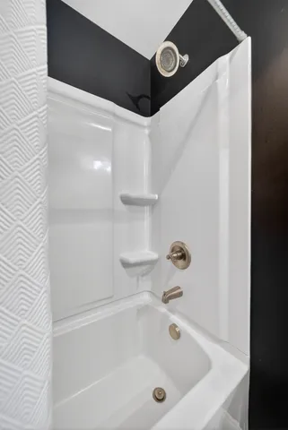 a kitchen with stainless steel appliances granite countertop a refrigerator a stove and a sink with wooden floor