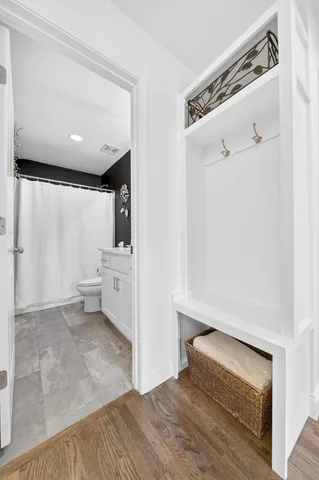a view of a livingroom with wooden floor
