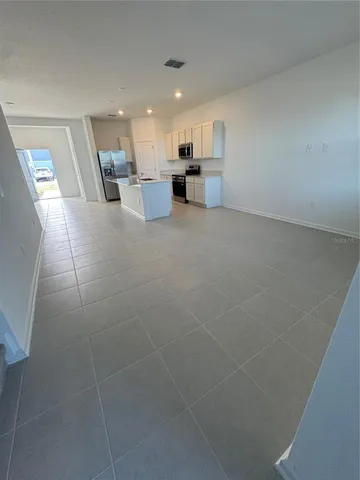 a view of a room with an empty space