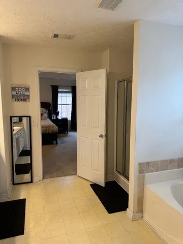 a living room with furniture and a walk in closet