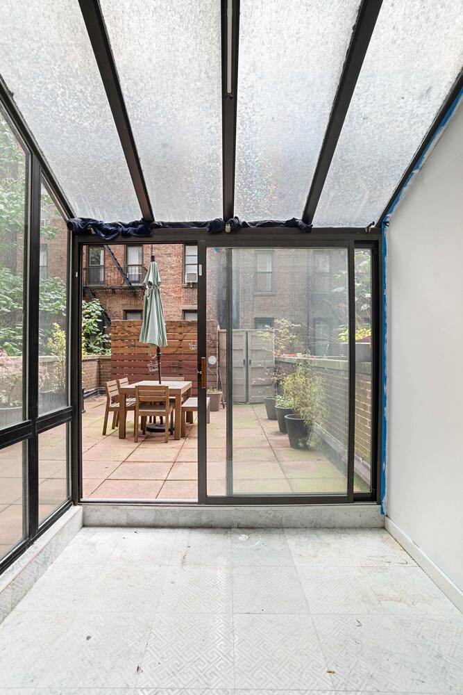 225 East 86th Street, Unit 204 Manhattan, NY 10028 - Photo 14 of 17 a view of a building with a porch