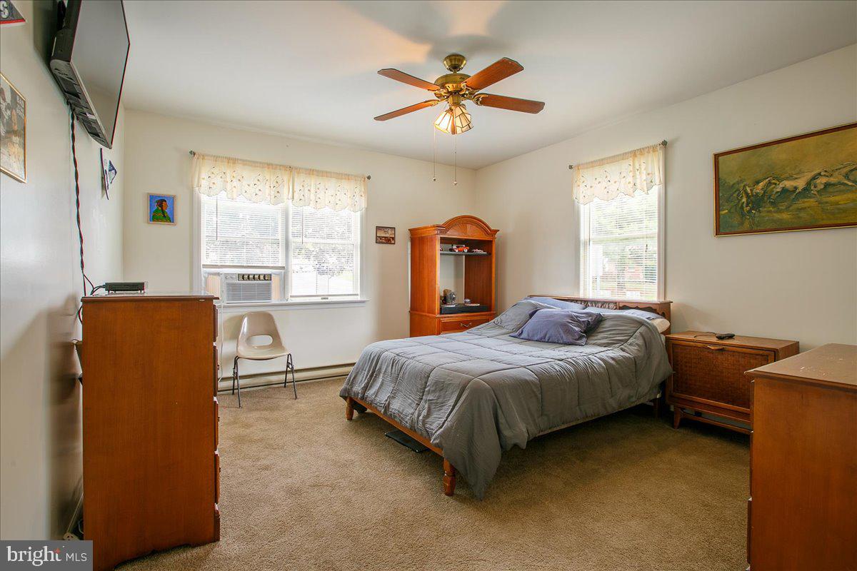 3 Winding Way Lititz, PA 17543 - Photo 15 of 34 a bed room with a bed and a ceiling fan