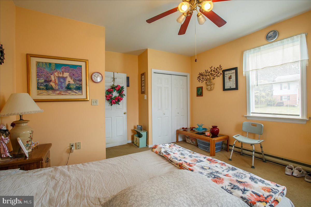 3 Winding Way Lititz, PA 17543 - Photo 18 of 34 a bedroom with a bed and a chandelier
