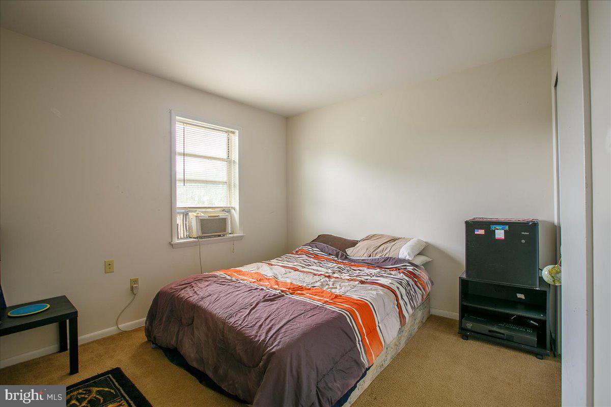 3 Winding Way Lititz, PA 17543 - Photo 22 of 34 a bedroom with a bed and wooden floor