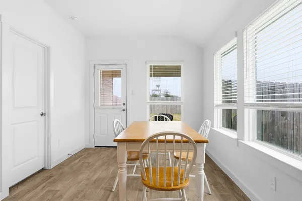 a view of hall way with furniture