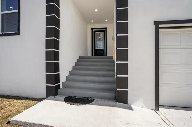 a view of staircase with white walls