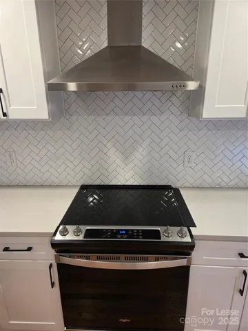 an empty room with wooden floor