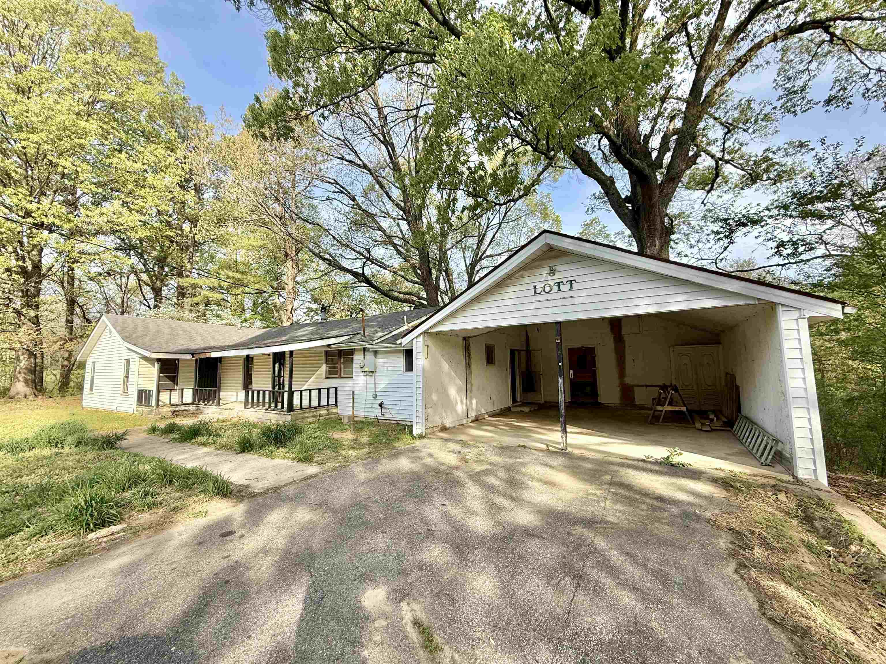 845 Needham Road Drummonds, TN 38023 - Photo 3 of 22 Ranch-style house featuring driveway, a porch, and an attached carport