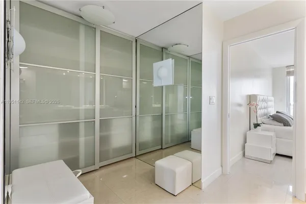 a kitchen with stainless steel appliances kitchen island a refrigerator sink and cabinets