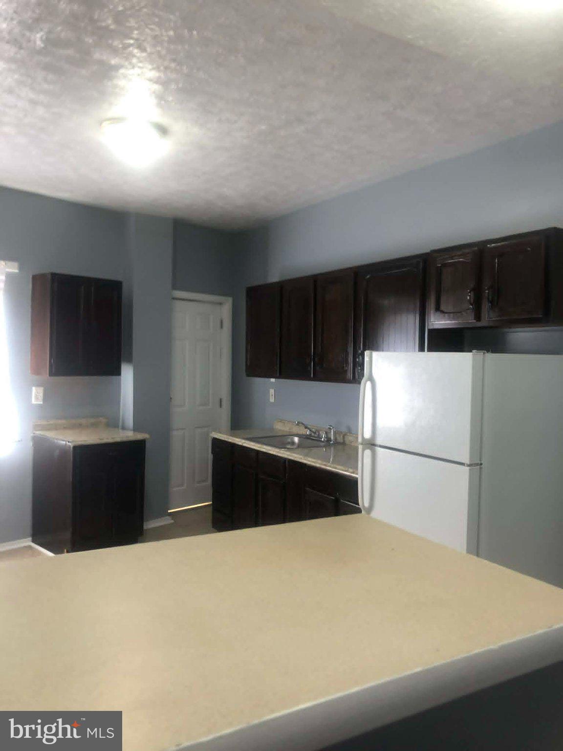 2671 St Benedict Street Baltimore, MD 21223 - Photo 4 of 21 Modern kitchen with sleek cabinetry.