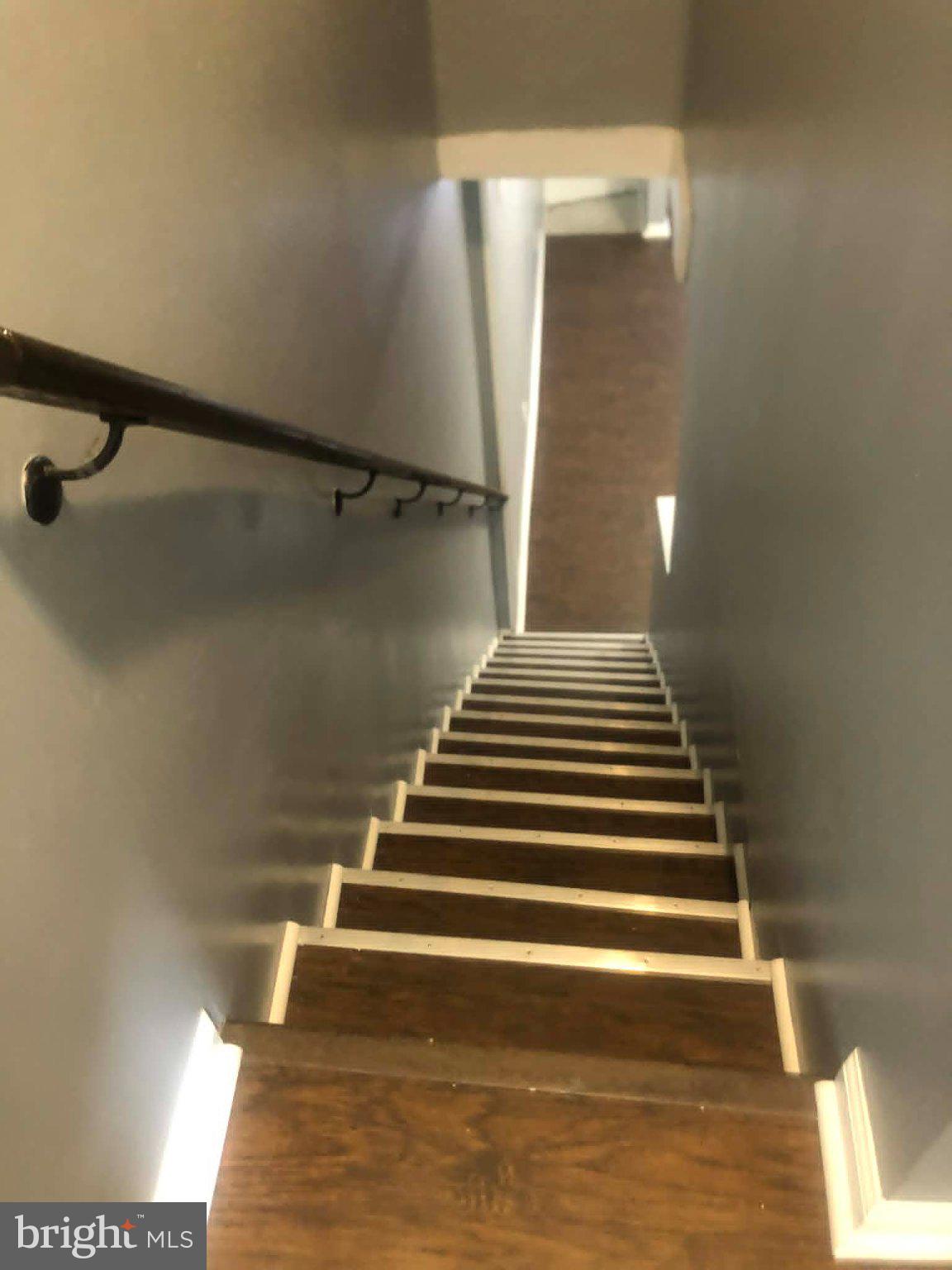 2671 St Benedict Street Baltimore, MD 21223 - Photo 7 of 21 Inviting staircase with modern charm.