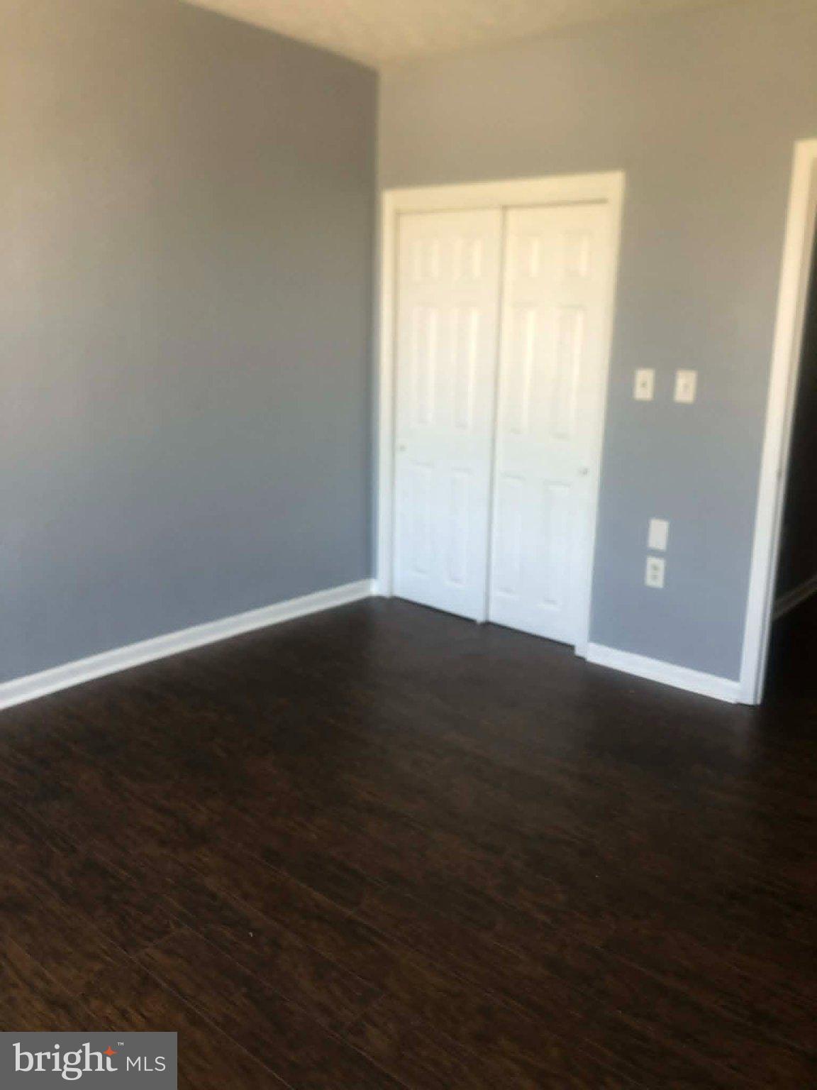 2671 St Benedict Street Baltimore, MD 21223 - Photo 10 of 21 Spacious room with serene gray walls.