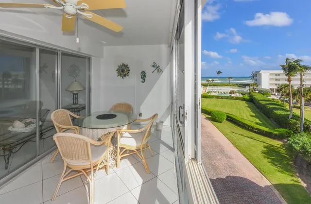 a view of a chairs and table in a patio