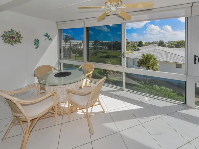 a view of a dining room with furniture wooden floor and chandelier